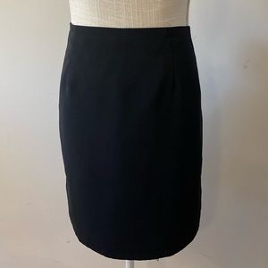 Briggs New York woman’s black lined short dressy skirt zip back closure sz 10P